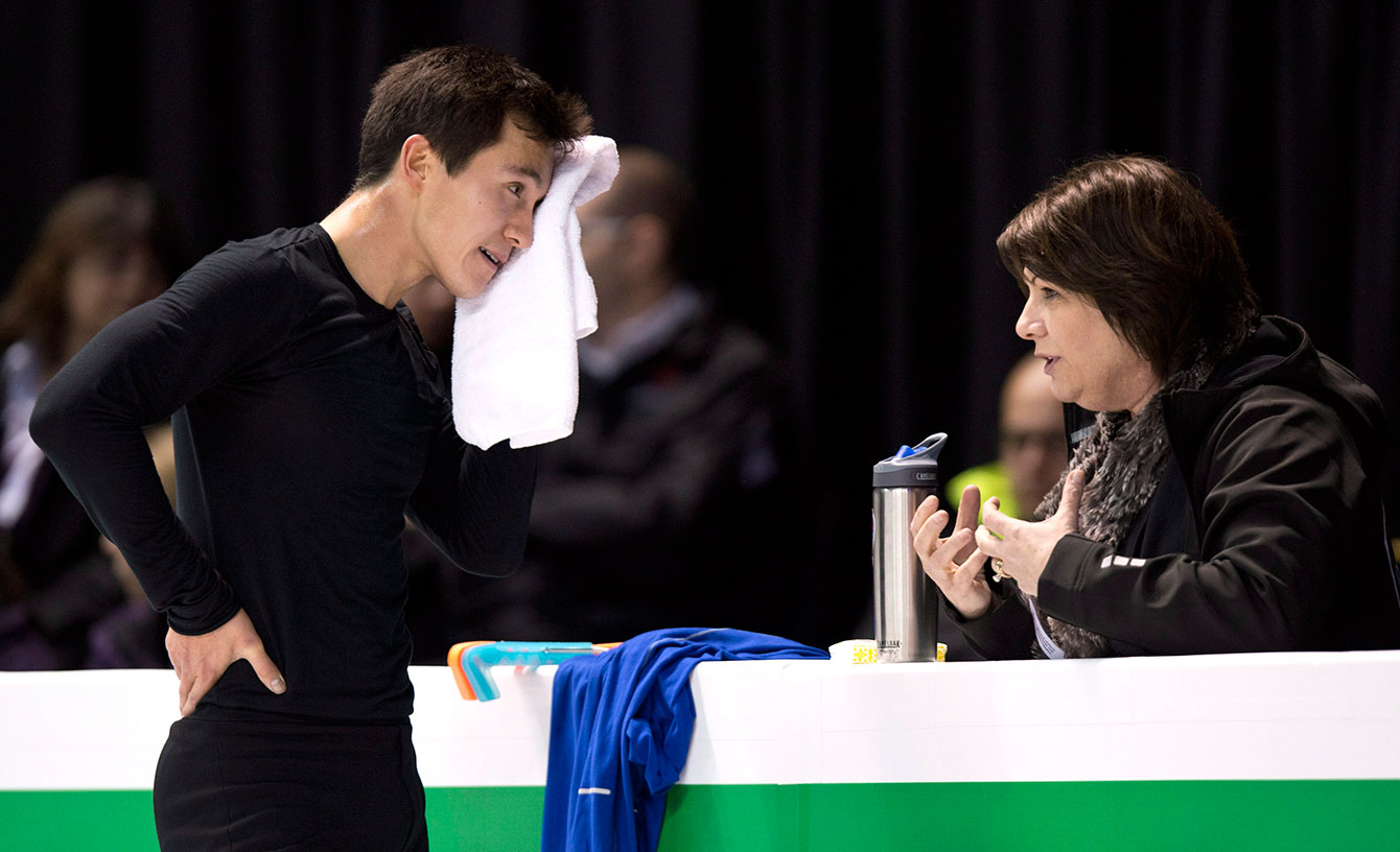 Chan with his coach Kathy Johnson at a practice during 2013 World Figure Skating Championships.