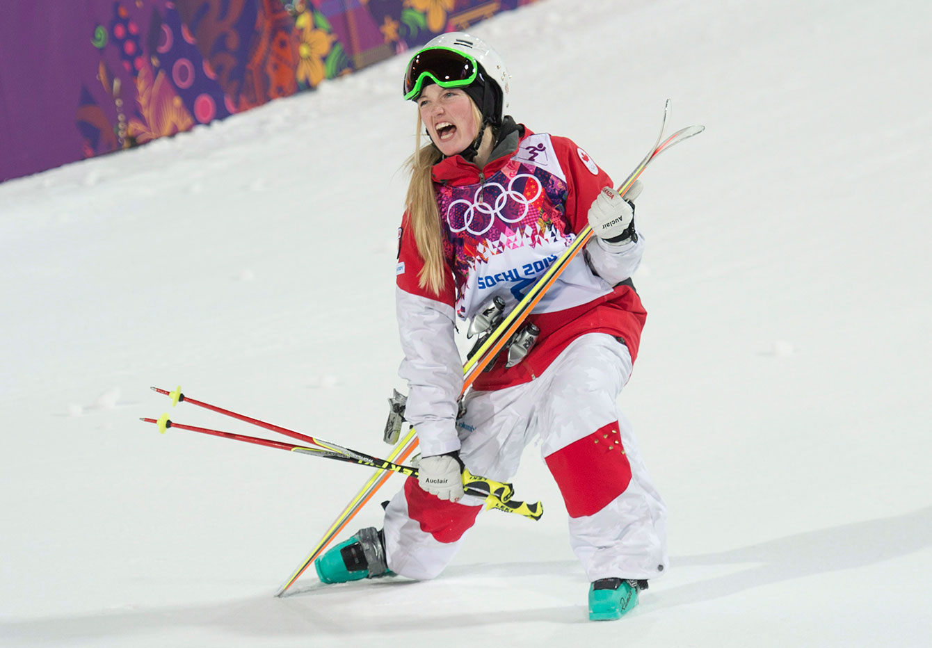 Canada's Justine Dufour-Lapointe celebrates after winning the gold medal in the moguls at the Sochi Winter Olympics Saturday February 8, 2014.