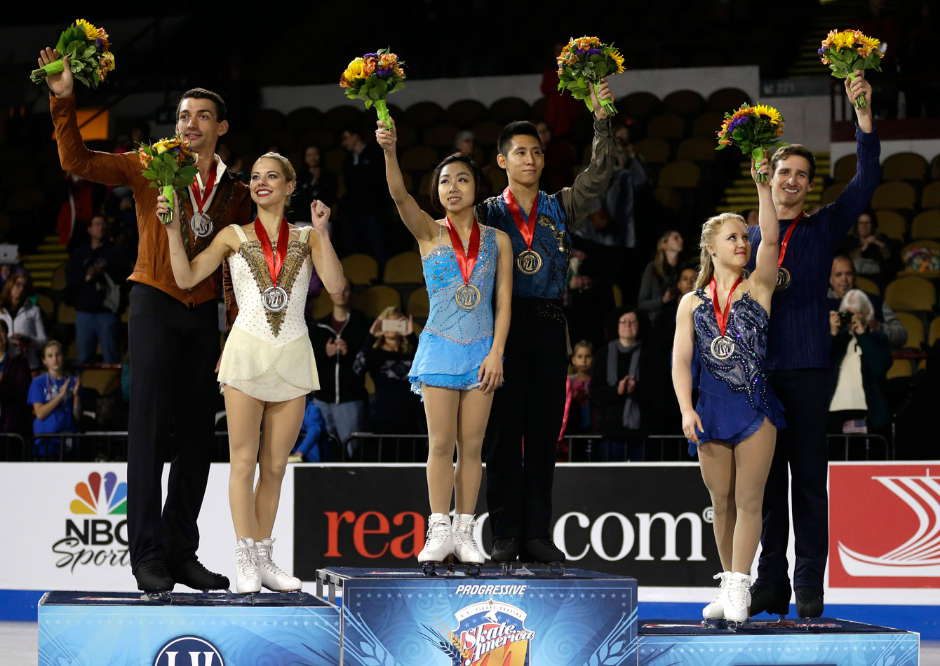 Julianne Seguin and Charlie Bilodeau (third on the podium, right) at Skate America in Milwaukee, Wisconsin on October 24, 2015.