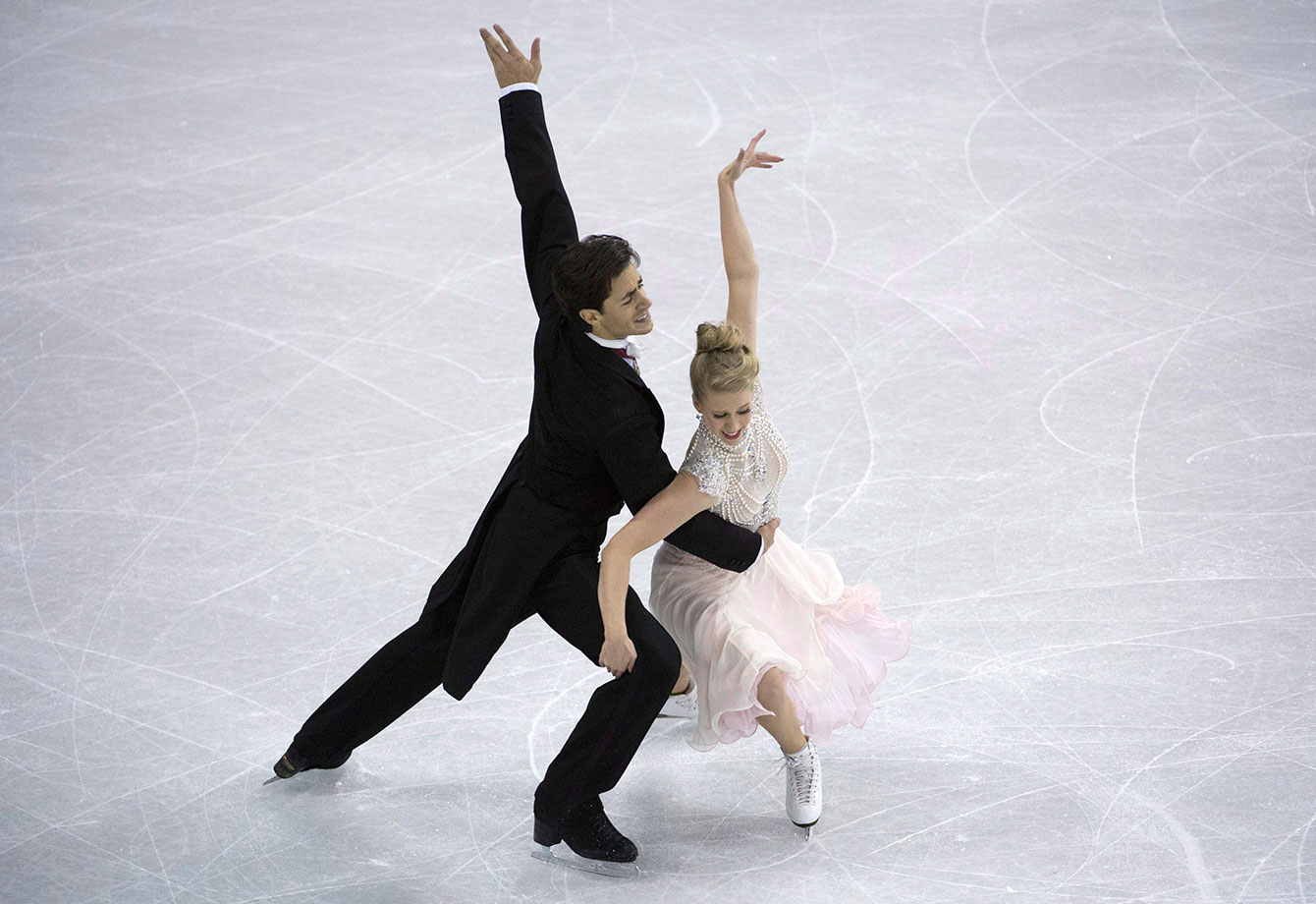 Kaitlyn Weaver and Andrew Poje during their short program on October 30, 2015 at Skate Canada International. 