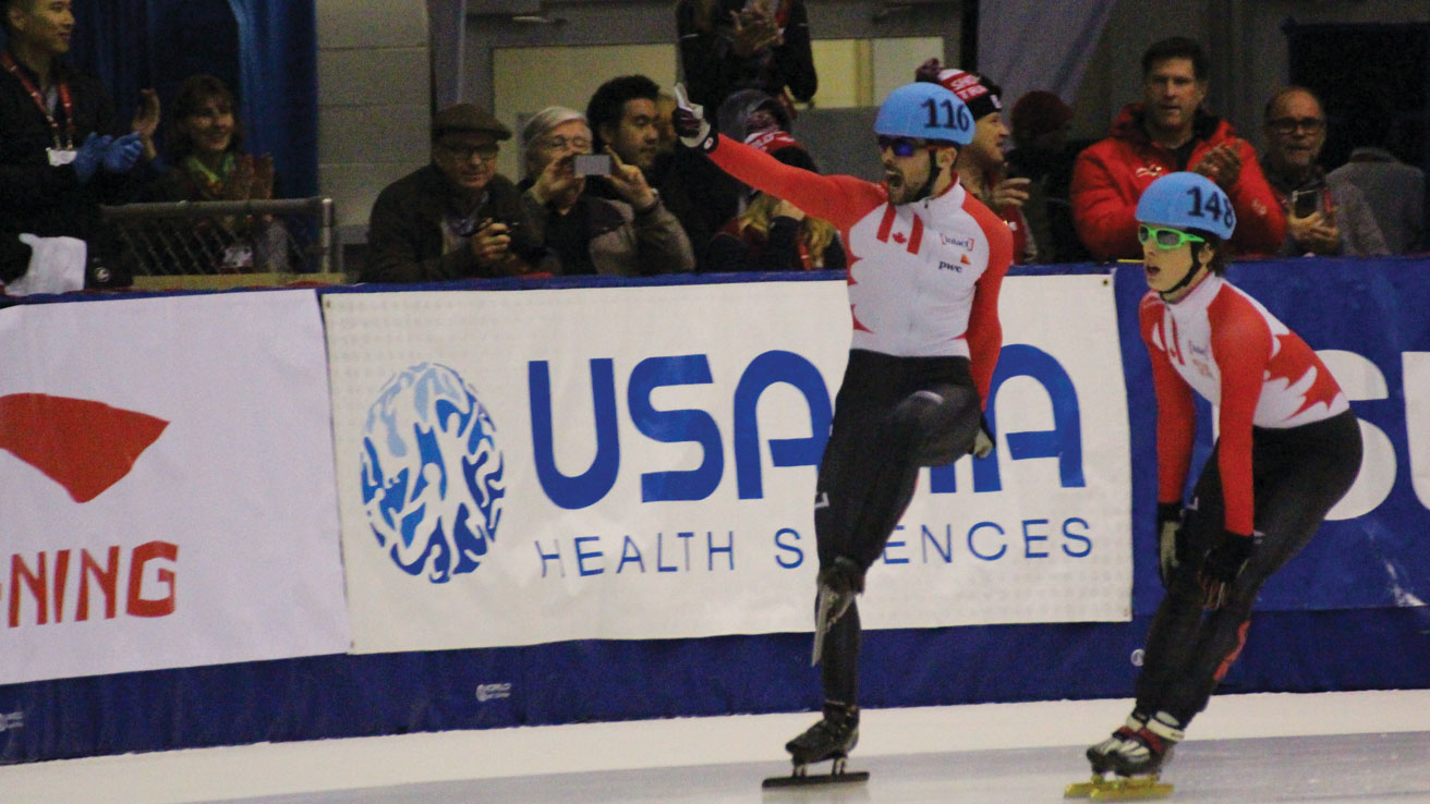 Francois Hamelin (left) celebrates his 1500m World Cup bronze medal in Toronto on Saturday, November 7, 2015.