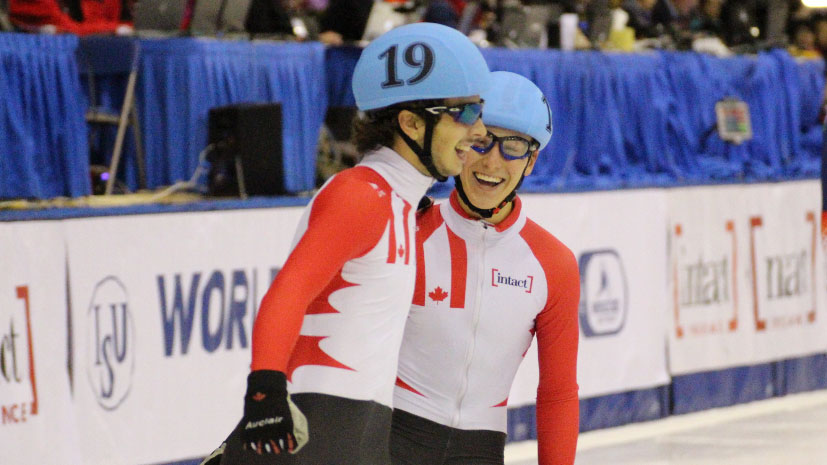 Sam Girard (19 on helmet) and Sasha Fathoullin celebrate their 1-2 World Cup finish for Canada in the men's 500m on November 7, 2015 in Toronto.