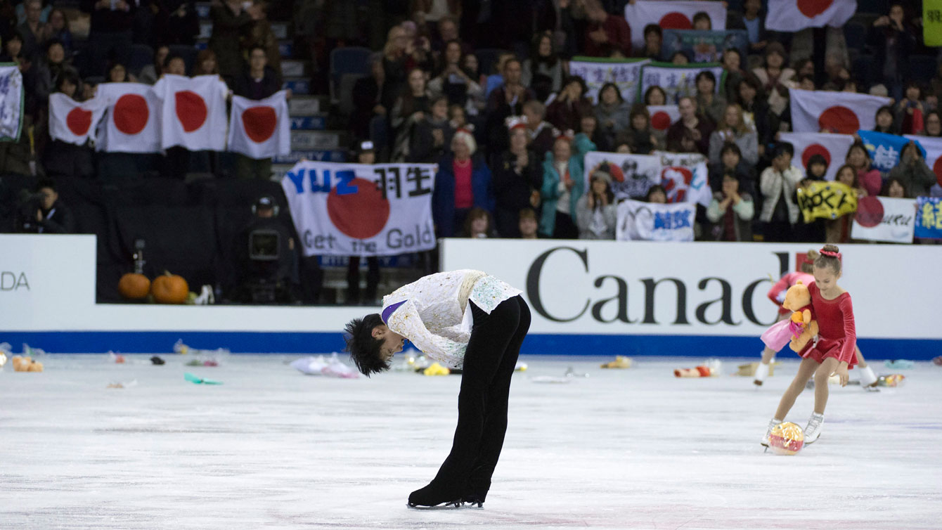 Fans litter the ice in Lethbridge with gifts after Yuzuru Hanyu wraps up his competition with a technically superb free skate on October 31, 2015. 
