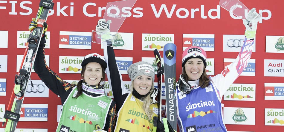 Kelsey Serwa (left) celebrates her second place finish at a FIS World Cup ski cross event in Innichen, Italy on December 20, 2015 (Photo via Alpine Canada).