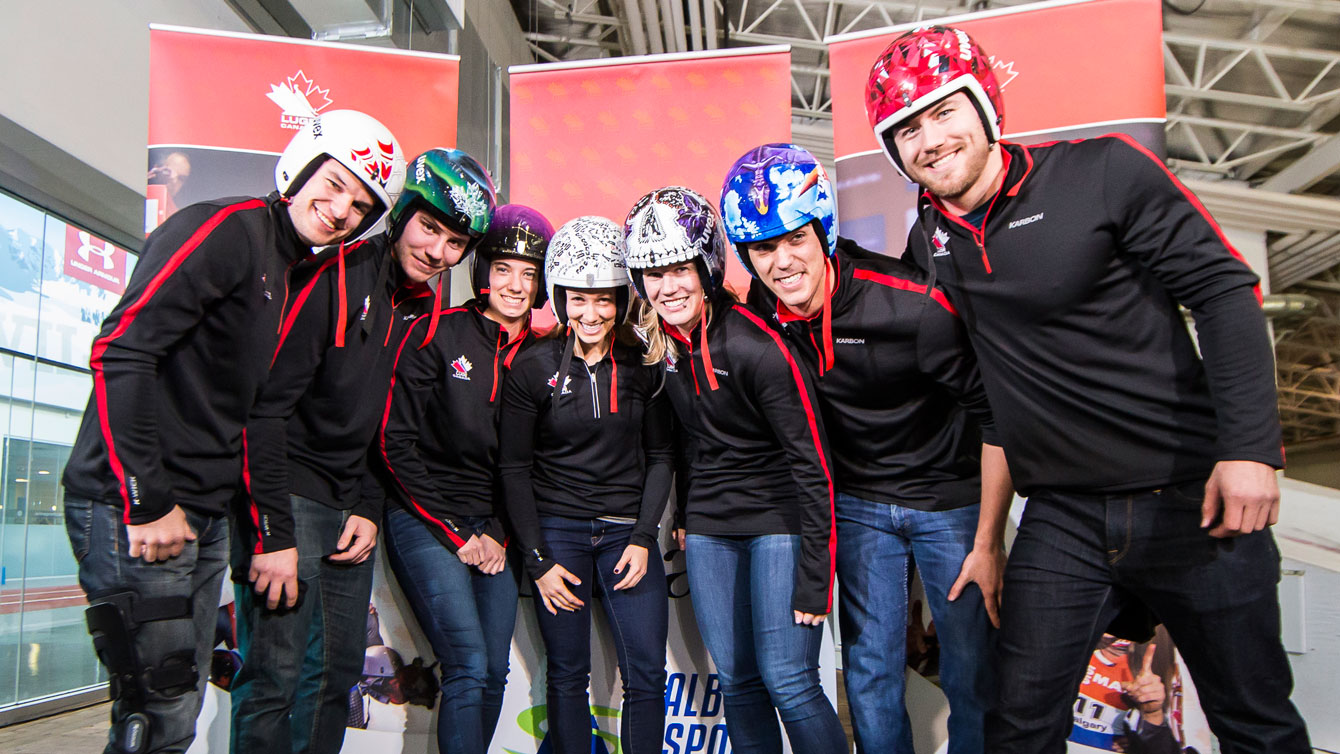 Canadian Luge Association athletes show off their artist-designed helmets on December 14, 2015, ahead of the Luge World Cup in Calgary (Photo: Dave Holland/Luge Canada).