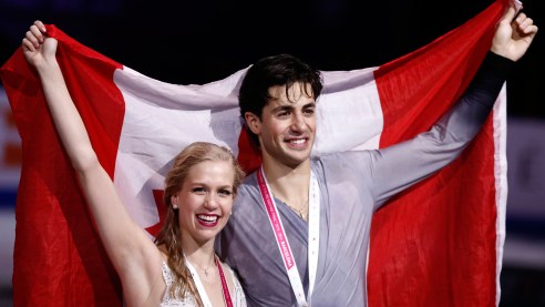 Kaitlyn Weaver and Andrew Poje on the podium after winning the ice dance title at the Grand Prix Final in Barcelona on December 12, 2015.