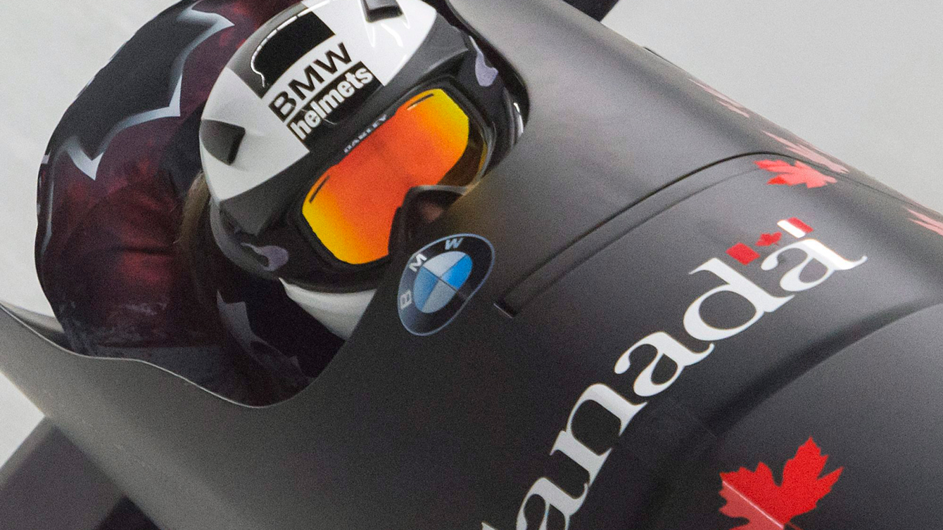 Kaillie Humphries her pusher Melissa Lotholz compete during the women's two-man bobsled competition at the Bob World Cup in Altenberg, Germany, Nov. 27, 2015. 