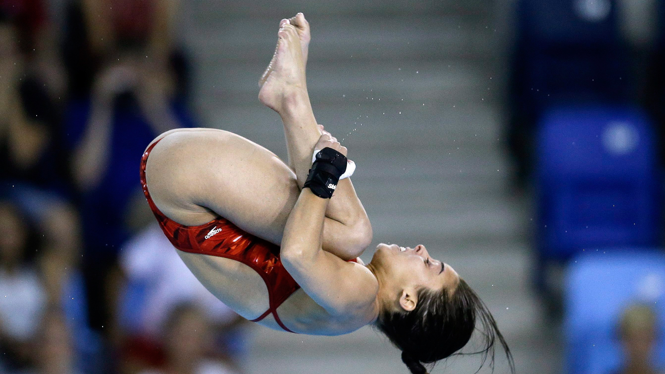 Meaghan Benfeito of Canada dives during the women's 10-meter platform event at the Pan Am Games Saturday, July 11, 2015, in Toronto. (AP Photo/Mark Humphrey)
