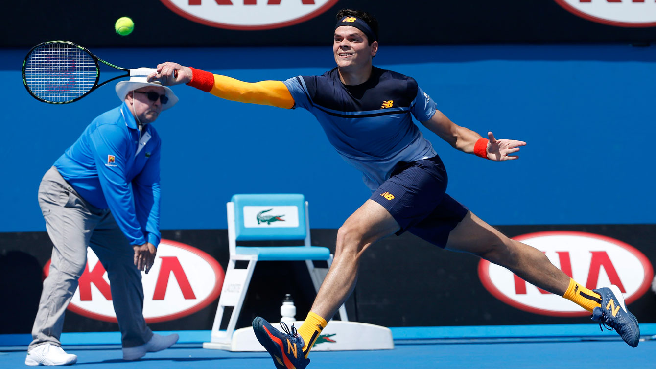 Milos Raonic reaches for a return during the opening round of the Australian Open on January 19, 2016.