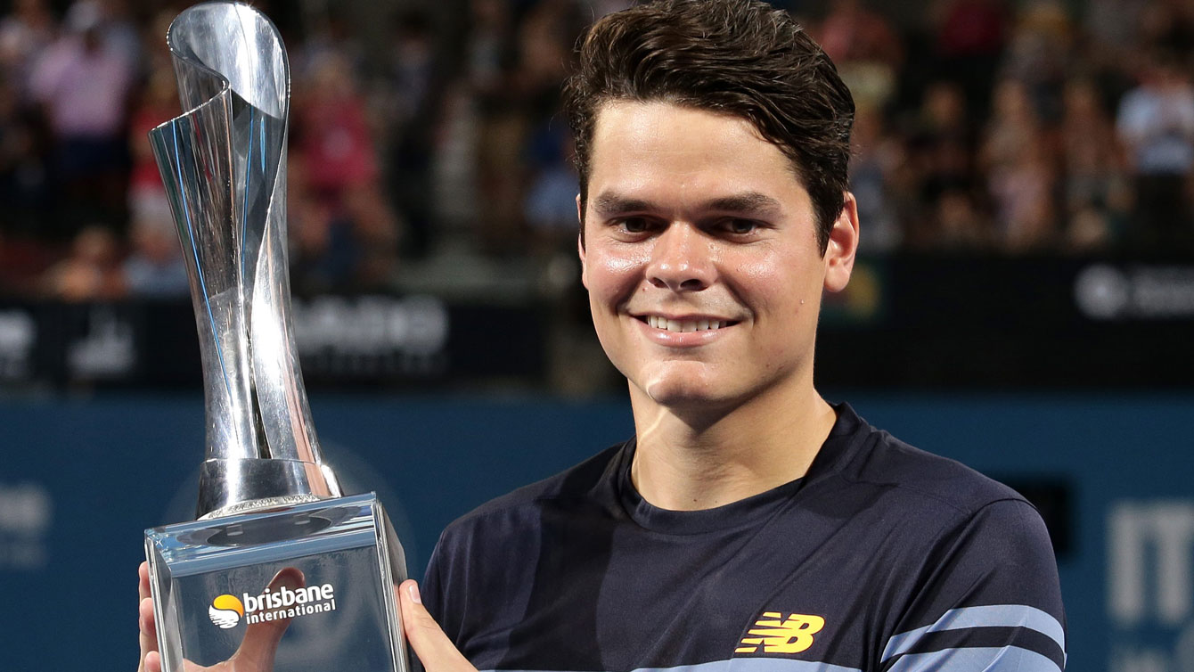 Milos Raonic holds aloft the Brisbane International trophy, his eighth ATP World Tour title won on January 10, 2016 by beating Roger Federer 6-4, 6-4. 