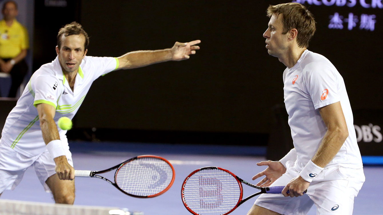 Radek Stepanek (left) reaches for a return as Daniel Nestor looks on at the Australian Open men's doubles final on January 30, 2016. 