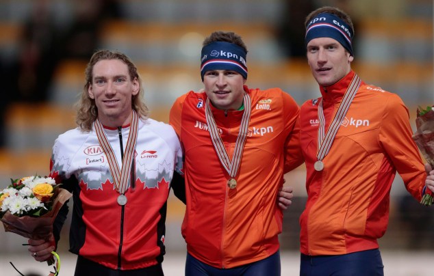 Ted posing with his medal alongside other medallists
