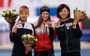 Blondin with her medal alongside other medallists
