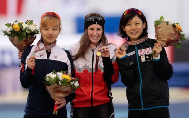 10738699 Blondin with her medal alongside other medallists