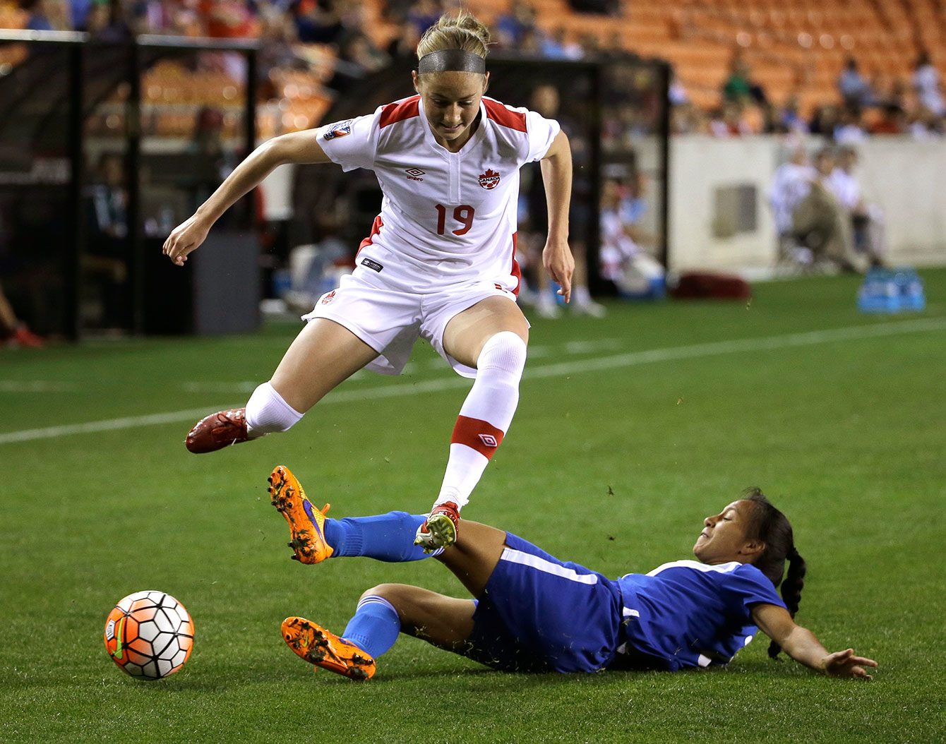 Janine Beckie tries to evade a sliding tackle against Guatemala in CONCACAF Olympic qualifying on February 16, 2016. 
