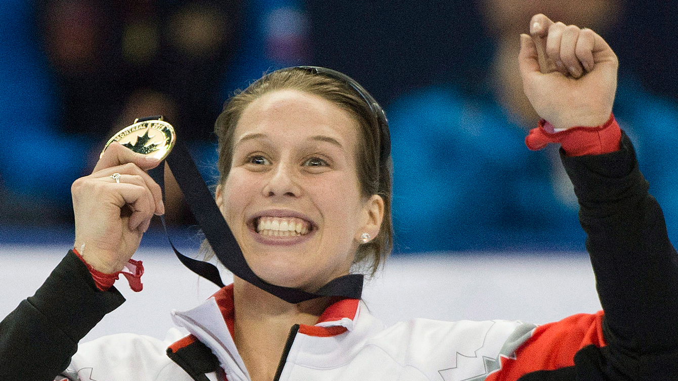 Marianne St-Gelais celebrates her medal after winning the women's 500-metre final race at the ISU World Cup short-track speedskating competition in Montreal, Sunday, Nov. 1, 2015.