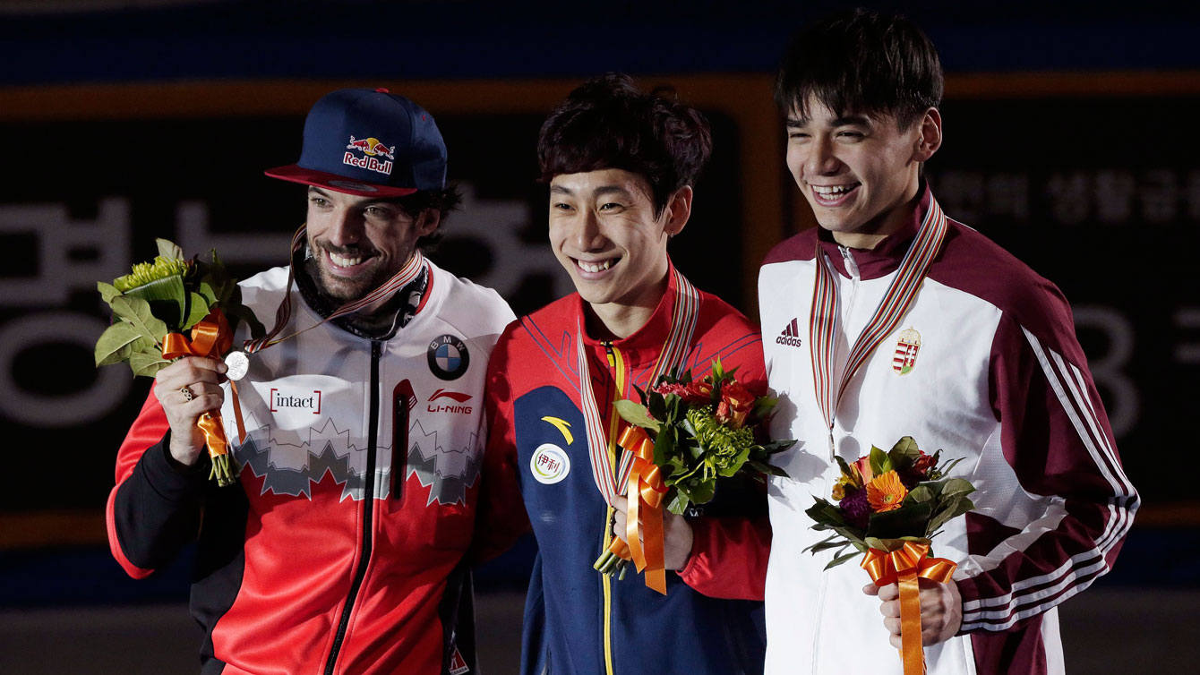 Charles Hamelin (left in silver position) during the presentation of the overall points awards at the 2016 ISU World Short Track Speed Skating Championships in Seoul, South Korea on March 13, 2016.