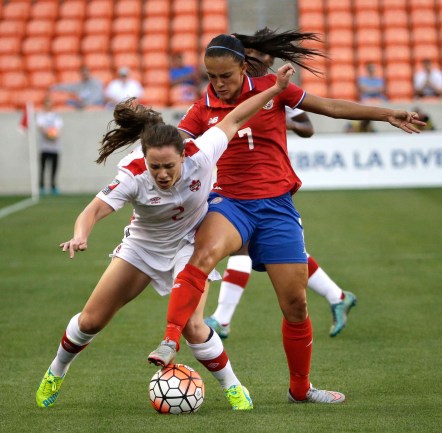 Canada's Allysha Chapman (2) challenges Costa Rica's Melissa Herrera (7) for the ball during the first half of a CONCACAF Olympic women's soccer qualifying championship semifinal Friday, Feb. 19, 2016, in Houston. (AP Photo/David J. Phillip)