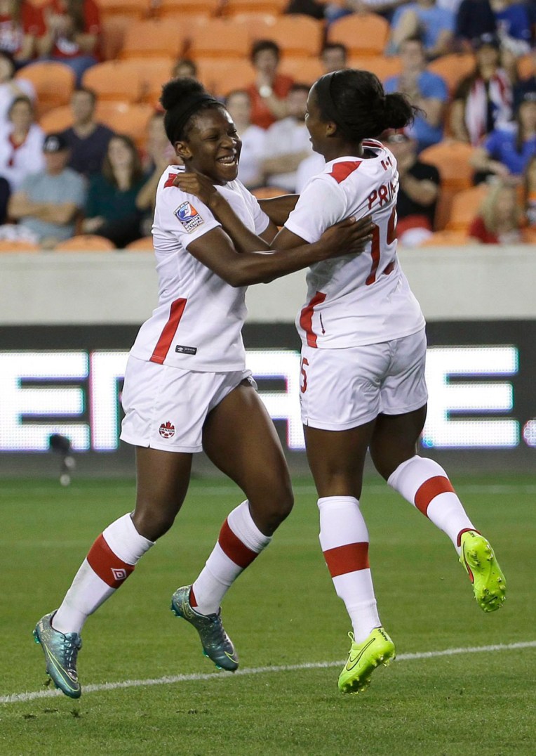Canada's Deanne Rose, left, celebrates after scoring a goal with Nichelle Prince during the second half of a CONCACAF Olympic women's soccer qualifying championship semifinal against Costa Rica, Friday, Feb. 19, 2016, in Houston. Canada won 3-1. (AP Photo/David J. Phillip)