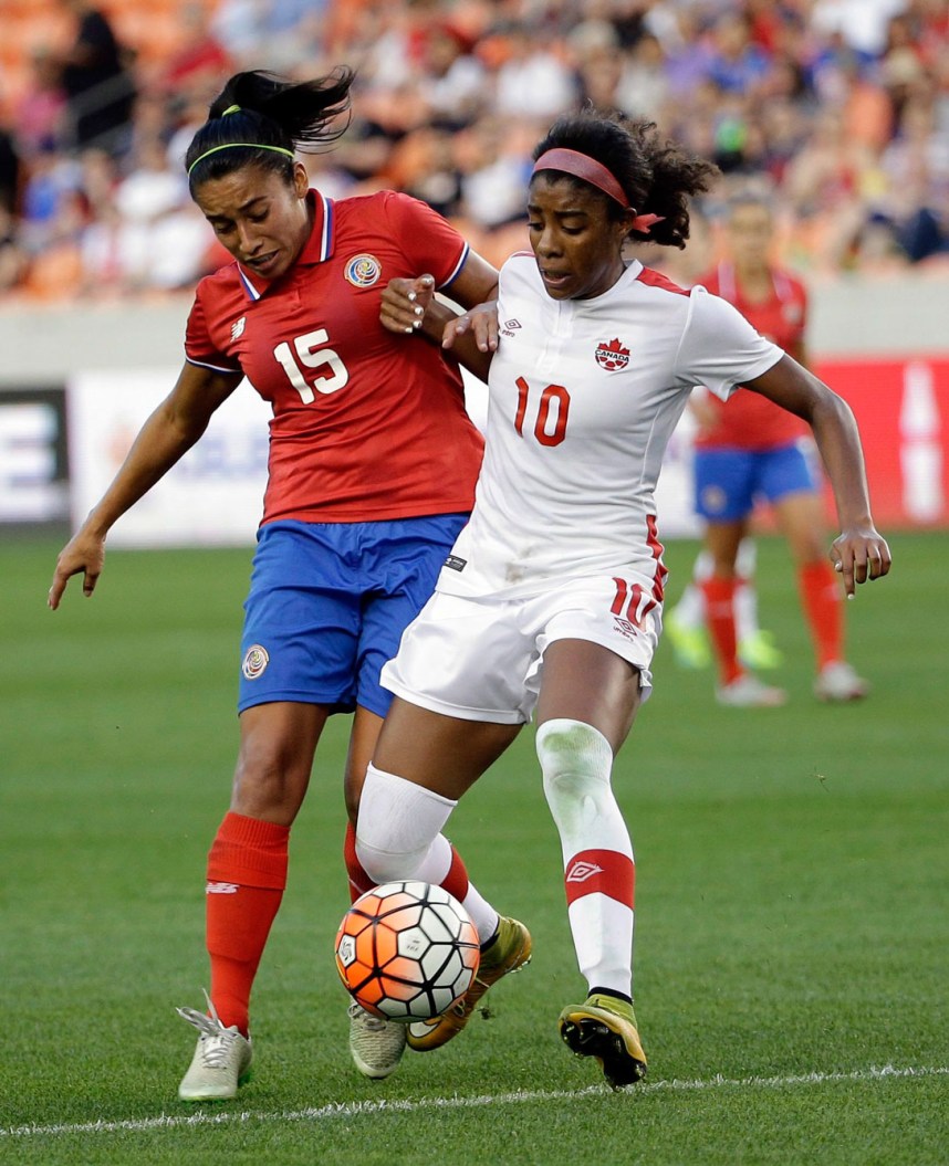 Canada's Ashley Lawrence (10) challenges Costa Rica's Cristin Granados (15) for the ball during the second half of a CONCACAF Olympic women's soccer qualifying championship semifinal Friday, Feb. 19, 2016, in Houston. Canada won 3-1. (AP Photo/David J. Phillip)