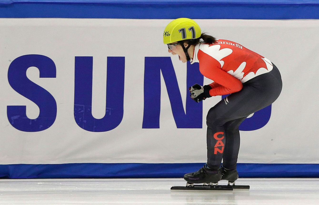 Marianne St-Gelais of Canada celebrates after wining the women's 1500 metre final at the ISU World Short Track Speed Skating Championships in Seoul, South Korea, Saturday, March 12, 2016. (AP Photo/Ahn Young-joon)