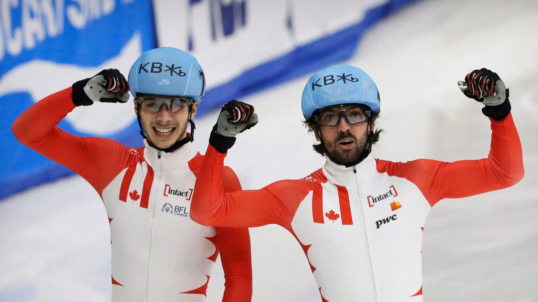 Charles Hamelin and Samuel Girard celebrate after a race