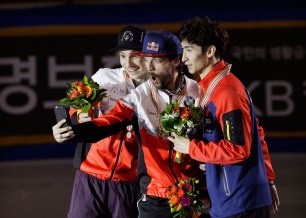 Hamelin poses for a selfie with the other medallists