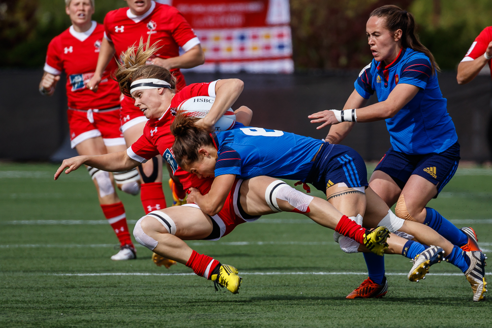 Karen Paquin is tackled during the Canadian team's loss to France at Canada 7s on April 17 in Langford, BC (Photo: Lorne Collicutt).