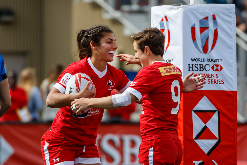 Ghislaine Landry congratulates teammate Bianca Farella after scoring a try against France in the cup quarterfinal at Canada 7s on April 17 in Langford, BC (Photo: Lorne Collicutt).