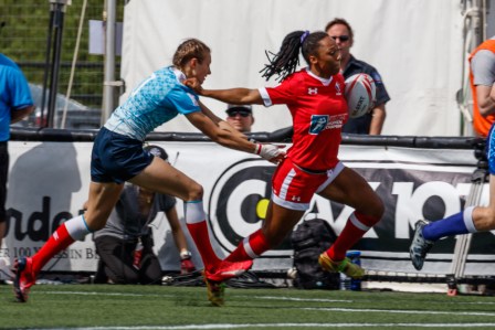 Charity Williams fends off a tackle in a win over Russia in the plate semifinal April 17 at Canada 7s in Langford, BC (Photo: Lorne Collicutt).
