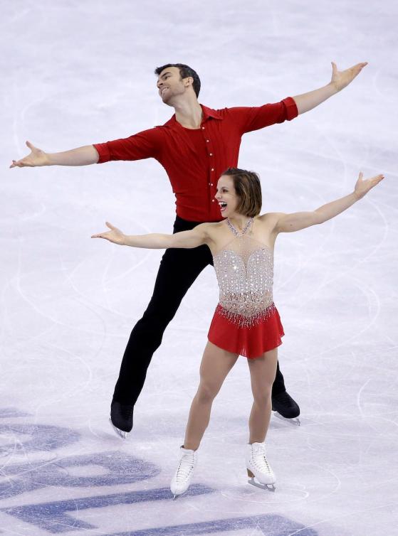 Meagan Duhamel and Eric Radford, of Canada, compete during the pairs short program in the World Figure Skating Championships, Friday, April 1, 2016, in Boston. (AP Photo/Elise Amendola)