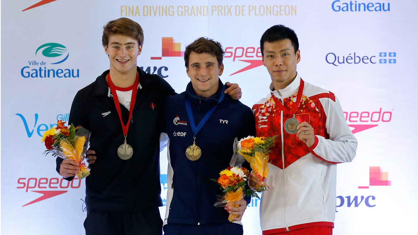 Philippe Gagne on the men's 3m springboard podium at the FINA Diving Grand Prix in Gatineau on April 10. (Greg Kolz)