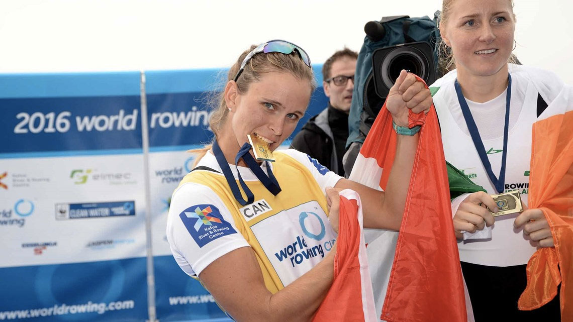 Carling Zeeman bites her gold medal at World Rowing Cup I after winning women's single sculls on April 17, 2016 in Varese, Italy (Photo: Detlev Seyb/MyRowingPhoto.com via FISA/World Rowing).