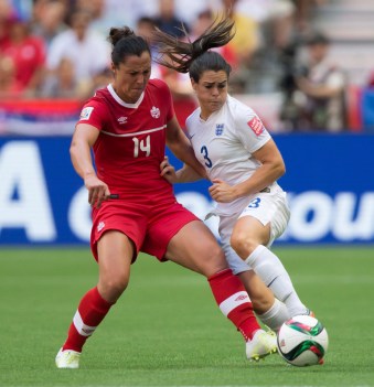 Canada's Melissa Tancredi, left, and England's Claire Rafferty vie for the ball during first half FIFA Women's World Cup quarter-final soccer action in Vancouver, B.C., on Saturday June 27, 2015. THE CANADIAN PRESS/Darryl Dyck