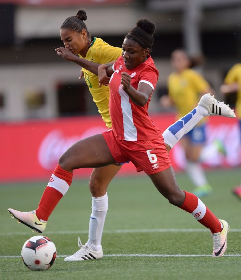 Canada's Deanne Rose (6) moves the ball past Brazil's Poliana during first half international women's friendly soccer action in Ottawa on Tuesday, June 7, 2016. THE CANADIAN PRESS/Sean Kilpatrick