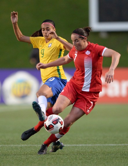 Canada's Rhian Wilkinson (7) moves the ball away from Brazil's A. Alves during second half international women's soccer friendly action in Ottawa on Tuesday, June 7, 2016. THE CANADIAN PRESS/Sean Kilpatrick