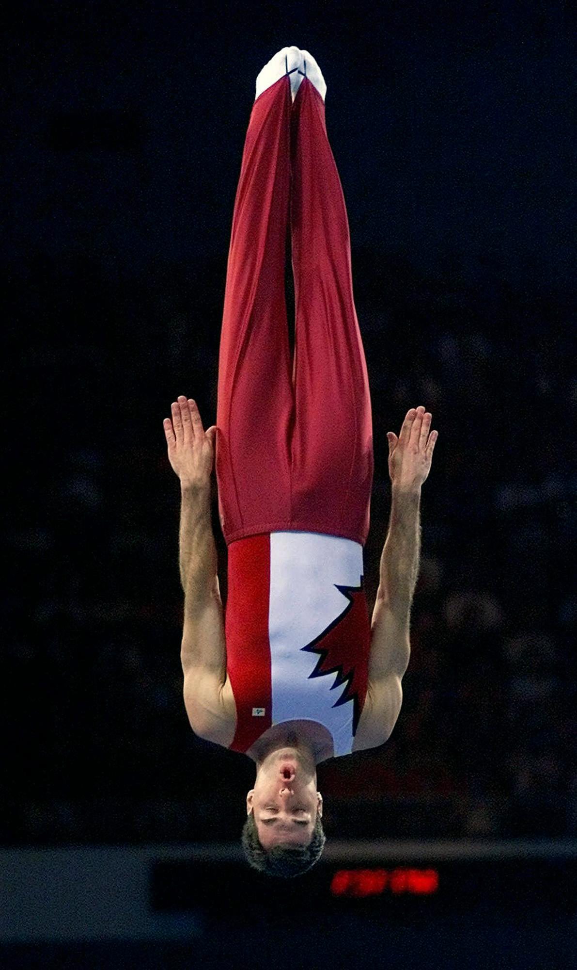 Mathieu Turgeon of Toronto performs his compulsory routine on the way to winning the bronze medal in the first ever men's trampoline competition at the Summer Olympics in Sydney on Saturday, Sept. 23, 2000. (AP Photo/Amy Sancetta)