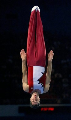 Mathieu Turgeon of Toronto performs his compulsory routine on the way to winning the bronze medal in the first ever men's trampoline competition at the Summer Olympics in Sydney on Saturday, Sept. 23, 2000. (AP Photo/Amy Sancetta)