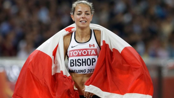 Melissa Bishop celebrates with the flag after winning 800m silver at the world championships in Beijing