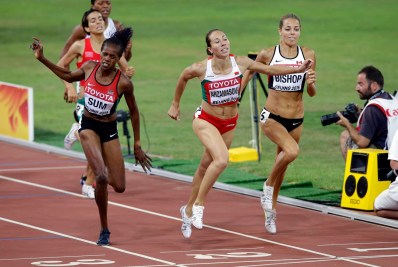 Bulgaria's Marina Arzamasova (centre) leans in ahead of Canada's Melissa Bishop (right)