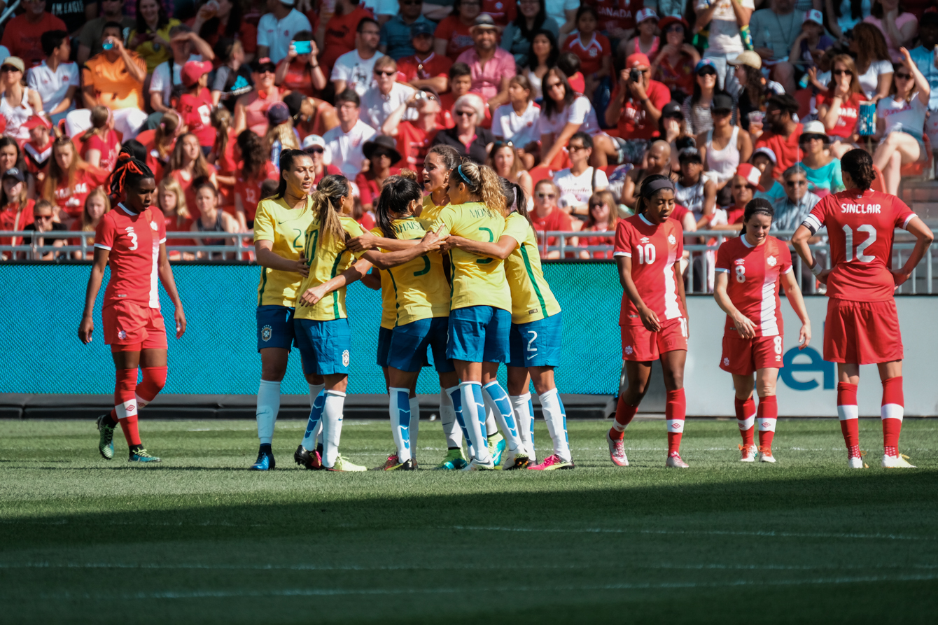 Brazil celebrates after taking a 1-0 lead on a goal from Marta 11 minutes into a match against Canada in Toronto on June 4, 2016. (Thomas Skrlj/COC)