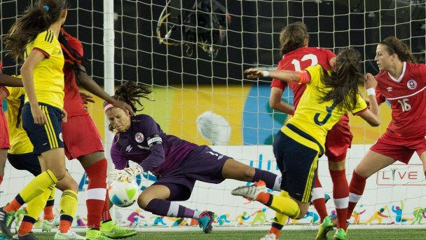Canadian goalkeeper Stephanie Labbe stops a shot during Pan Am Games football semifinal against Colombia on July 22, 2015.