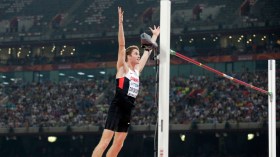 Derek Drouin celebrates a clearance in the high jump