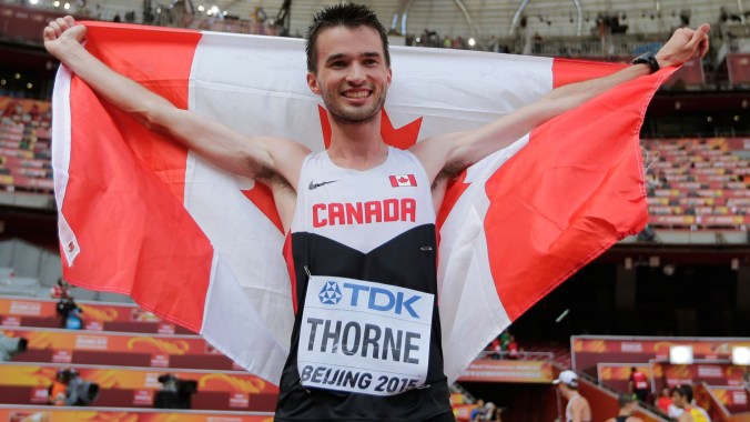 Ben Thorne holds up the maple leaf after winning IAAF World Championship in Athletics bronze