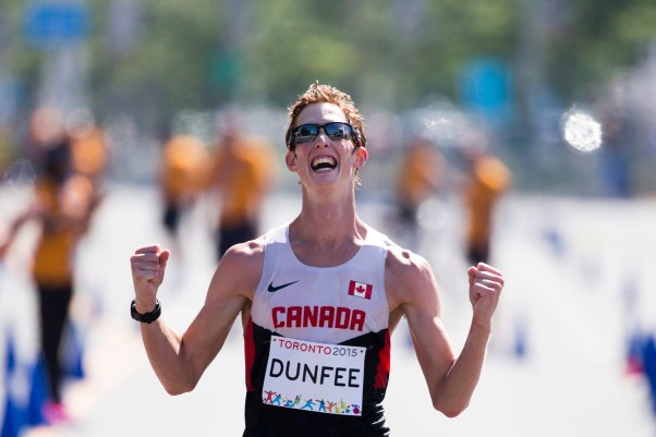 Canada's Evan Dunfee reacts as he crosses the finish to win the men's 20km race walk at the Pan Am Games in Toronto, Ontario, Sunday, July 19, 2015. (AP Photo/Felipe Dana)