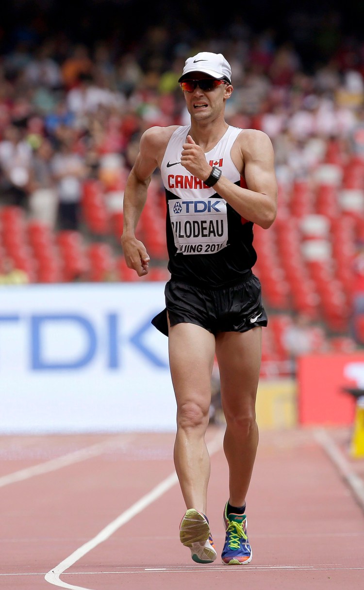 Canada's Mathieu Bilodeau competes in the mens 50km race walk final at the World Athletics Championships at the Bird's Nest stadium in Beijing, Saturday, Aug. 29, 2015. (AP Photo/David J. Phillip)