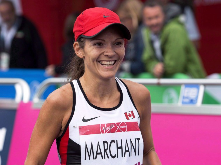 Canada's Lanni Marchant smiles after racing to a fourth place finish in the women's marathon at the Commonwealth Games in Glasgow, Scotland on Sunday, July 27, 2014. THE CANADIAN PRESS/Andrew Vaughan