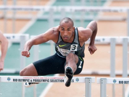 Damian Warner competes a heat of the senior men 110m hurdles during the Canadian Track and Field Championships and Selection Trials for the 2016 Summer Olympic and Paralympic Games, in Edmonton, Alta., on Sunday July 10, 2016. THE CANADIAN PRESS/Dan Riedlhuber