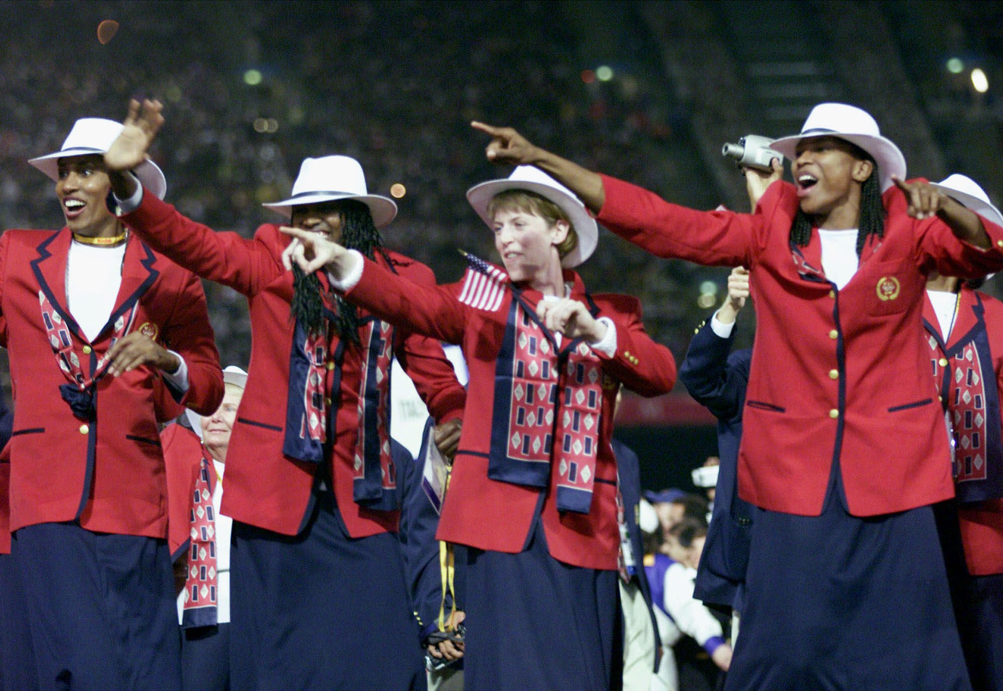 Members of the USA women's basketball team march onto the field during the opening ceremony for the Summer Olympics Friday, Sept. 15, 2000, at Olympic Stadium in Sydney. (AP Photo/David Guttenfelder)