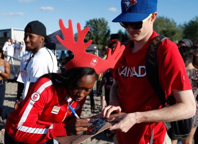 Khamica Bingham signs autographs at the Team Canada Beach Party.